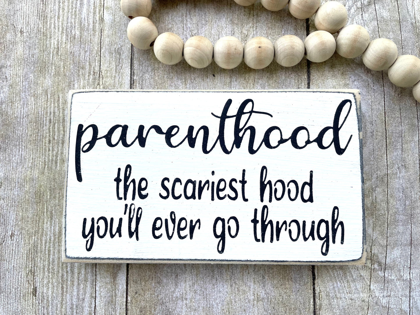 parenthood the scariest hood you'll ever go through wood sign